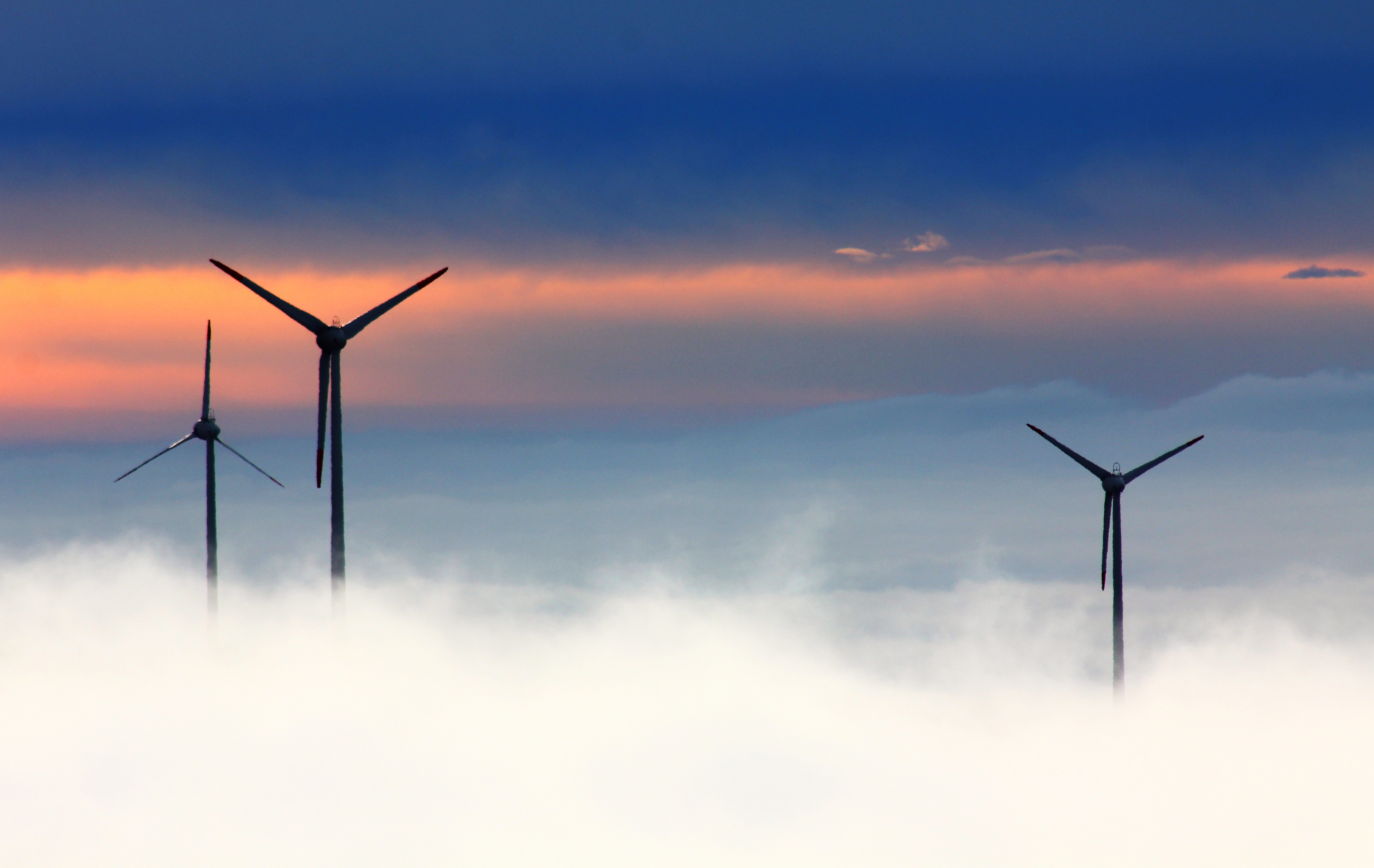 Windmills in a foggy power landscape